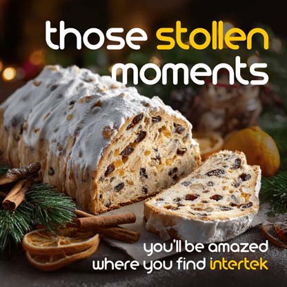 A loaf of sweet pastry bread with one piece sliced off